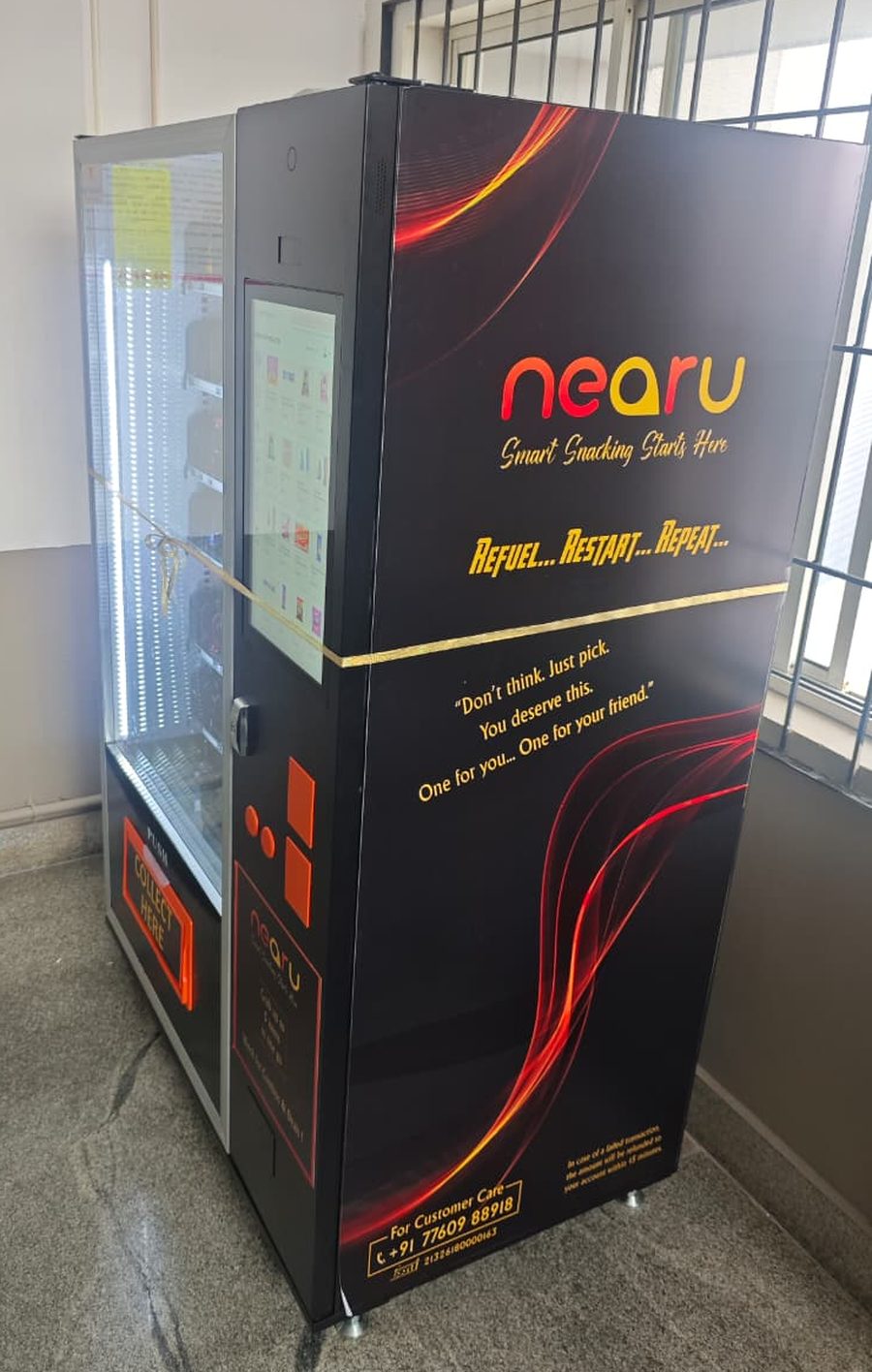 A NearU branded smart vending machine installed in a college block in Kerala
