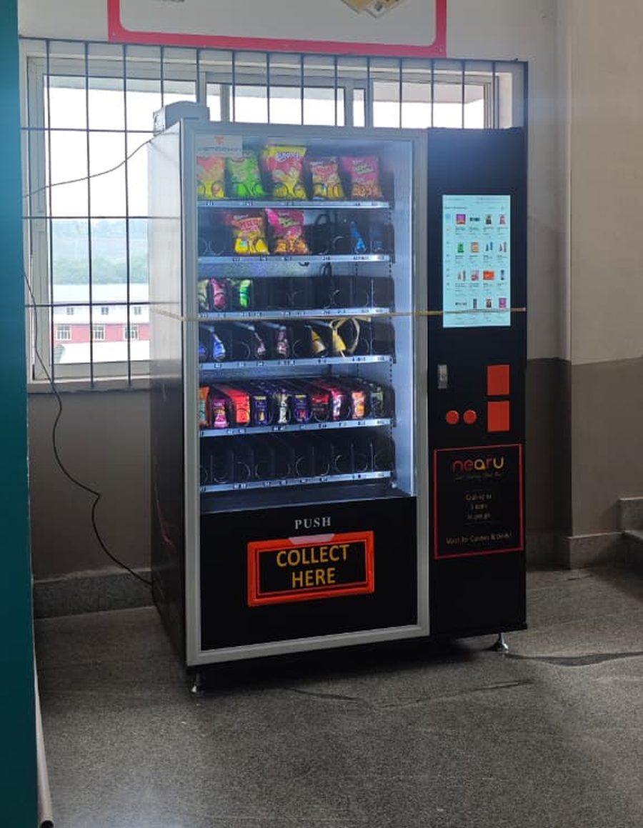 NearU vending machine in a college corridor in Kerala